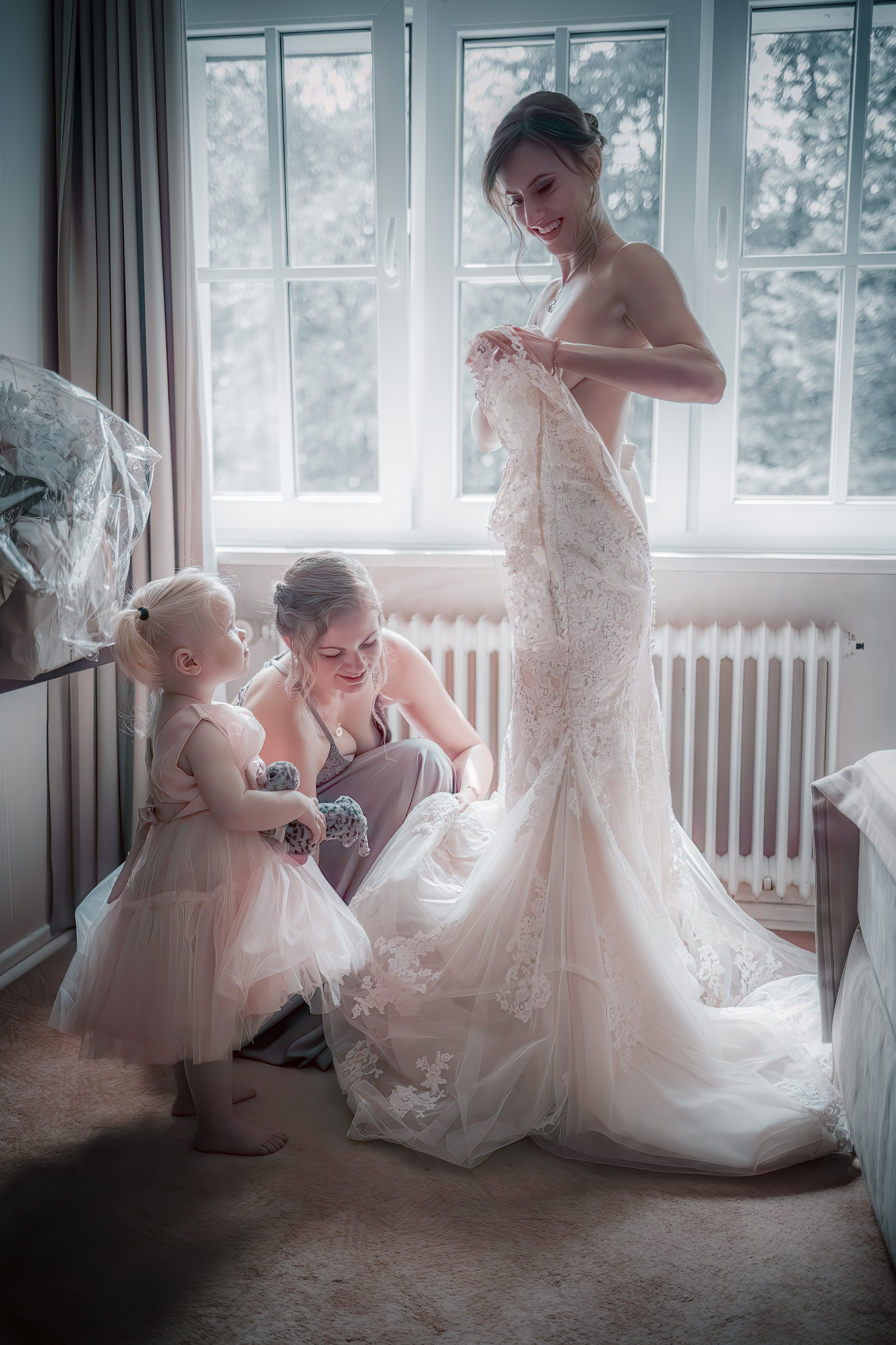 _54A0804-Bearbeitet-topaz-denoise a woman in a dress with a child in front of her