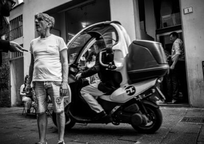 a man standing next to a motorcycle