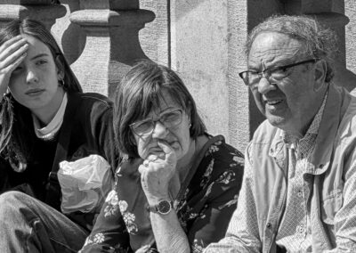 a group of people sitting on a bench